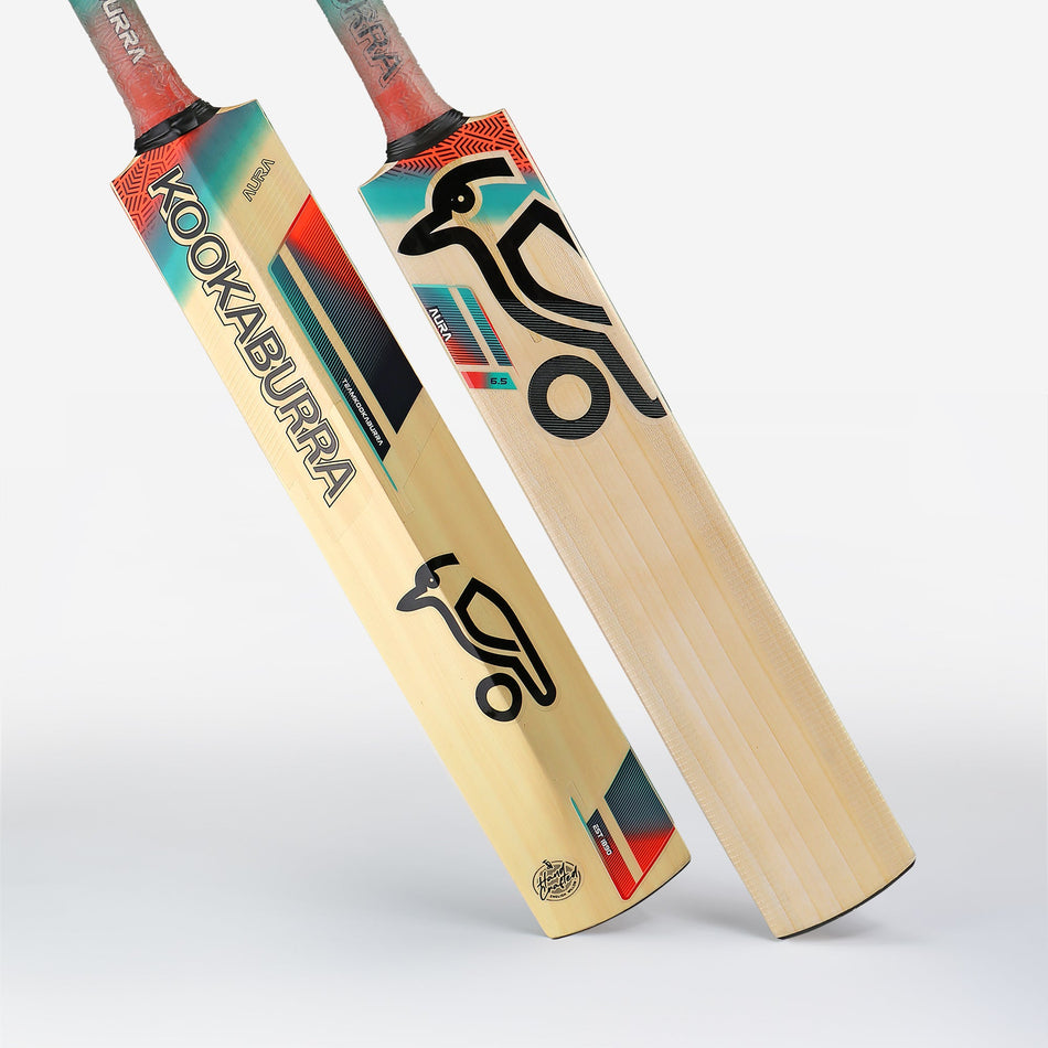 Two Kookaburra Aura 6.1 Junior Cricket Bats stand upright. The front bat displays the Kookaburra logo and vibrant design, while the back reveals its smooth English Willow blade—perfect for young cricketers seeking quality.