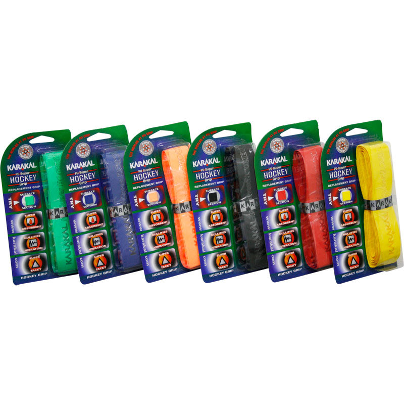Six packaged Karakal hockey grip tapes in various colors—green, blue, orange, black, red, and yellow—are arranged in a row, each in branded packaging with visible labels and icons.