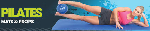 Woman in pink sports top does Pilates on a blue mat, holding a small blue exercise ball between her feet. The text reads PILATES MATS & PROPS on the left of the image.