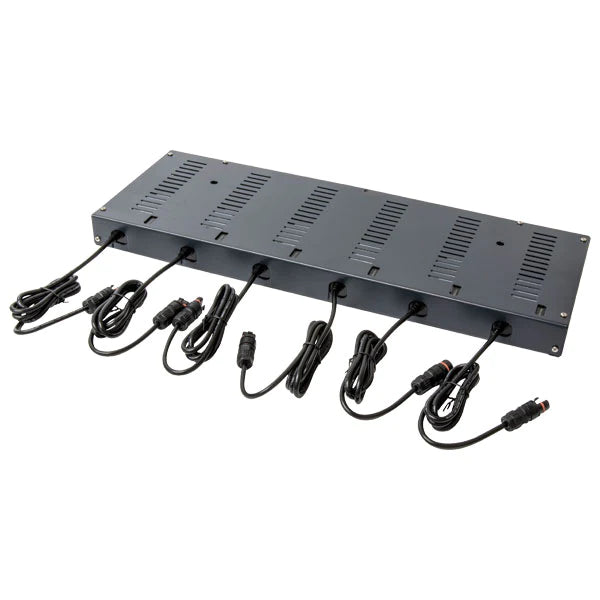 A black metal power distribution unit with multiple ventilation slots and six connected black power cables arranged along one side.