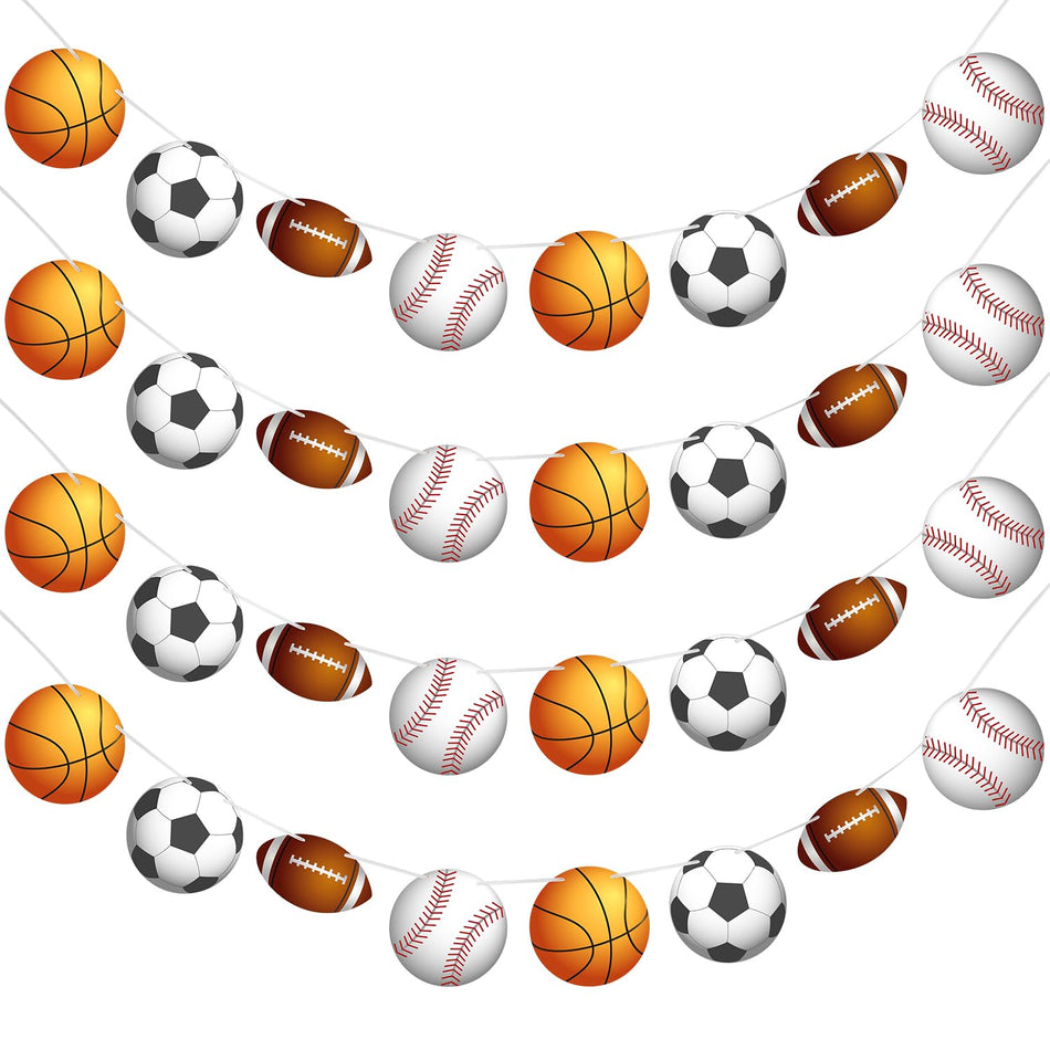 A garland made of paper balls resembling soccer balls, basketballs, baseballs, and footballs, strung in rows on white string against a white background.