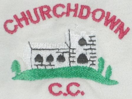 Embroidered logo of a white stone church with black windows and green bushes, with CHURCHDOWN in red above and C.C. below.
