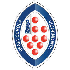 A blue and white oval crest with red circles, a figure in a robe, and the words REGIA SCHOLA VIGORNIENSIS around the border.