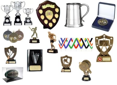 A collage of various sports trophies, medals, shields, plaques, a tankard, a rugby ball, and a medal in a box, all displayed on a white background.