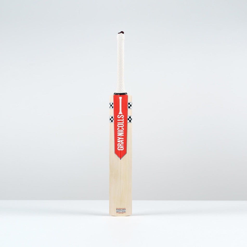 The Gray Nicolls Classic Pro Performance SH Cricket Bat 2026, featuring a large edge profile and the iconic red and white Gray Nicolls label, stands upright on a plain white surface against a light gray background.