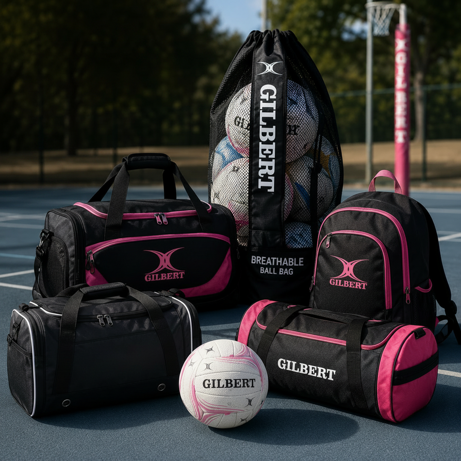 Three mesh sports bags in black, blue, and red, each labeled Gilbert, are filled with rugby balls and standing upright, with shoulder straps visible.