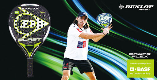 Padel player in white sportswear prepares to hit a ball with a Dunlop Blast racquet. The image highlights the racquet and features logos for Dunlop Sport and BASF.