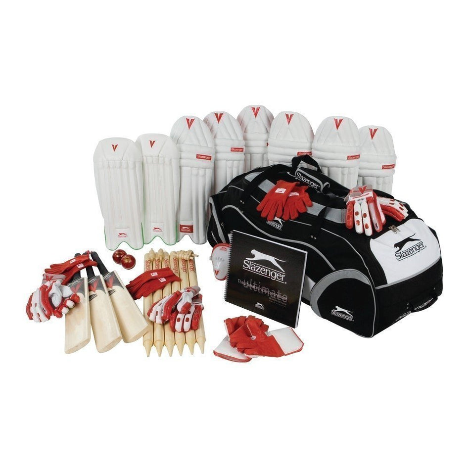 A complete cricket kit including bats, pads, gloves, balls, wickets, and a large black and white Slazenger bag, all arranged neatly on a white background.