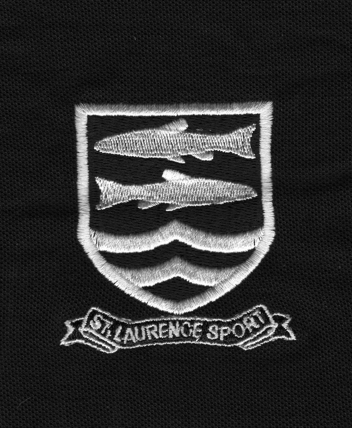A black patch with an embroidered white shield featuring three fish and wavy lines, above a banner that reads ST. LAURENCE SPORT.