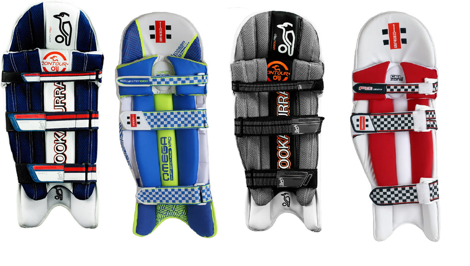 Four pairs of colorful cricket leg guards with various designs and patterns, each featuring straps and branding, displayed upright on a white background.