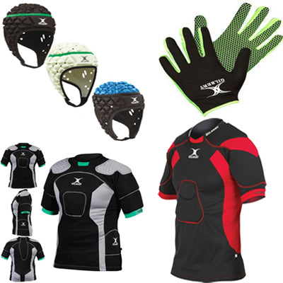 Assorted rugby protective gear including padded headguards, grip gloves, and padded shirts in black, grey, and red variations arranged on a white background.