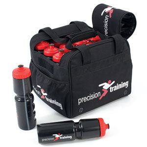 A black sports bag labeled precision training holds several black water bottles with red caps; two bottles and a black bottle holder are placed outside the bag.