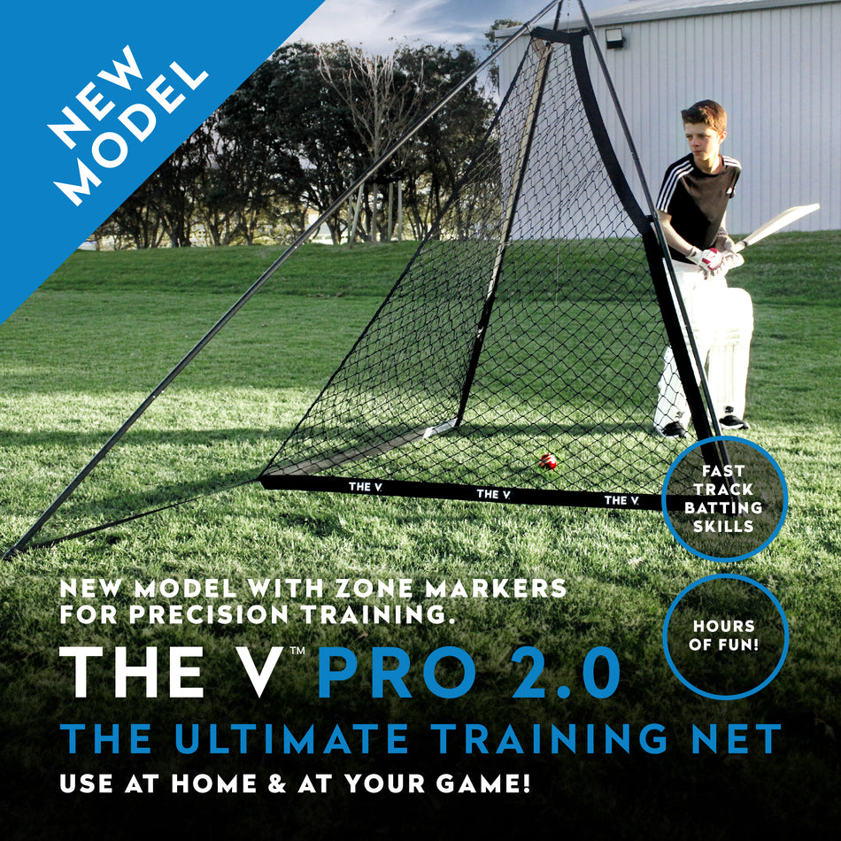 A person with a cricket bat stands beside The V Pro 2.0 by The V—a large V-shaped training net on grass, featuring precision training, zone markers, and tools for better batting skills. Text highlights: NEW MODEL – THE V PRO 2.0.