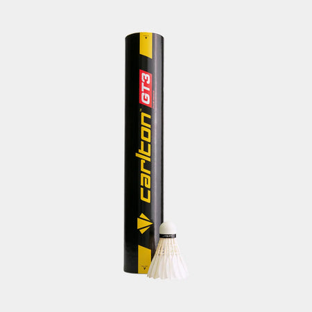 A black Carlton GT3 Club Grade shuttlecock tube stands upright beside a white duck feather shuttlecock, ideal for club-level badminton, on a light gray background. The product comes in a 12 Pack by Carlton.