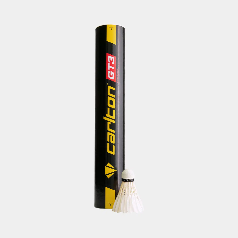 A black Carlton GT3 Club Grade shuttlecock tube stands upright beside a white duck feather shuttlecock, ideal for club-level badminton, on a light gray background. The product comes in a 12 Pack by Carlton.