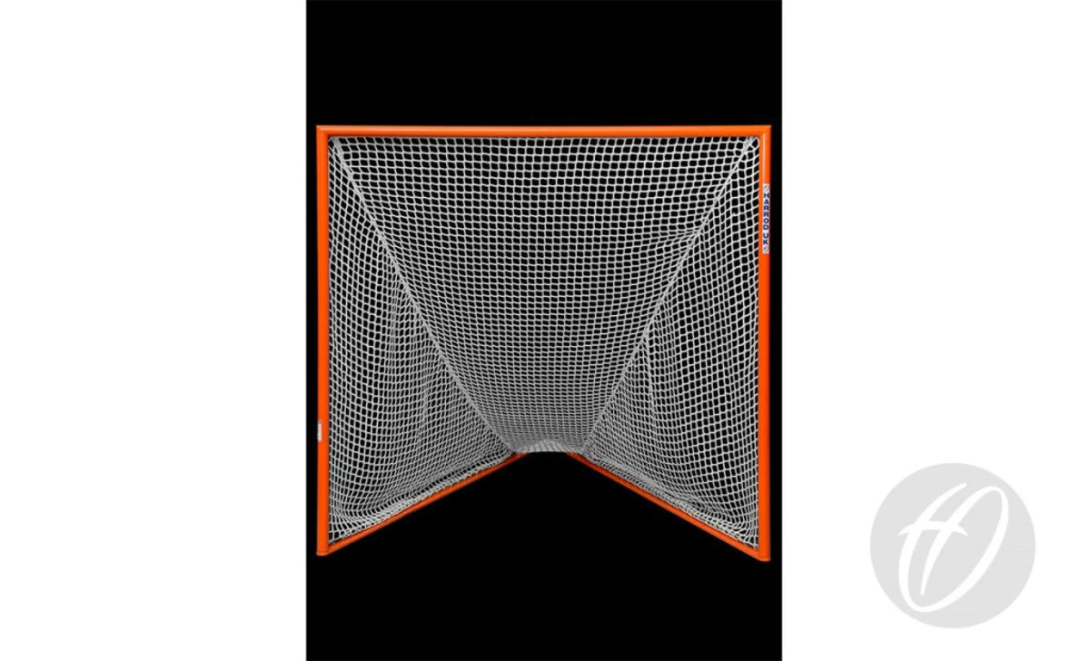 A Harrod Sport Competition Lacrosse Nets 5MM in white heavy-duty knotless construction is stretched over an orange lacrosse goal frame and viewed head-on against a black background, with a gray circular logo positioned in the bottom right corner.