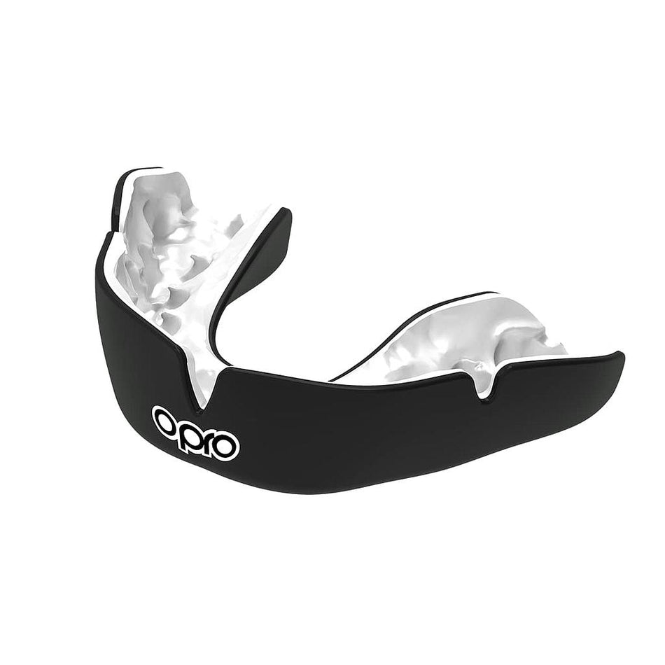 The OPRO Instant Custom Self Fit Mouthguard in Black/White features the Opro logo on the front, displayed on a white background. This mouthguard provides athletes with reliable protection during intense play.