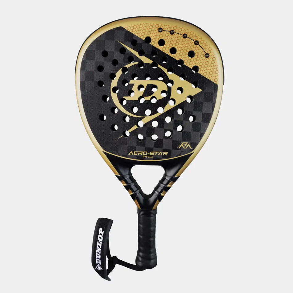 The Dunlop Aerostar Pro Padel Racket features a black and gold 16K Carbon bat, Power Holes, Tri-Clamp reinforcement, a perforated checkered face, and a black grip with a Dunlop wrist strap on a light gray background.