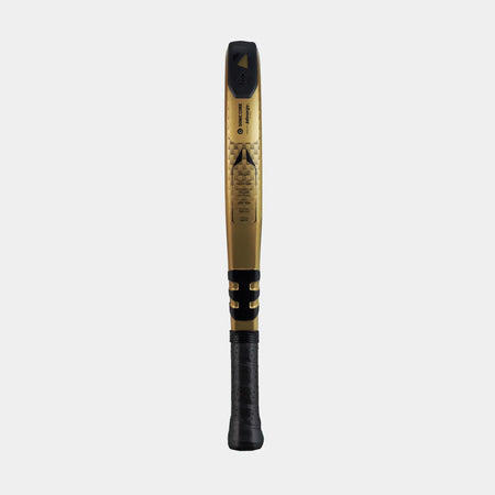 The Dunlop Aerolite Padel Racket by Dunlop, featuring a gold and black 16K Carbon frame with a Hyper Gryp finish and black grip, is displayed standing vertically on a plain white background.