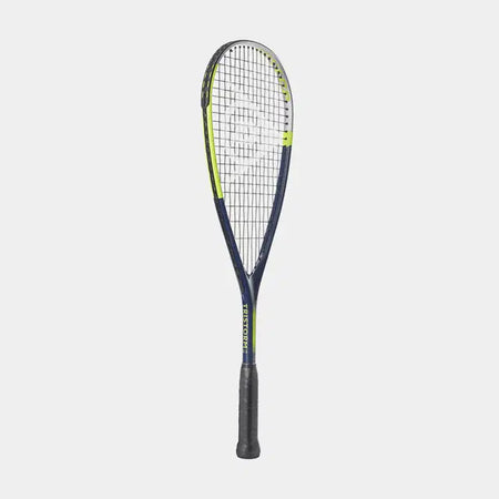 The Dunlop Tristorm Jr 25 Squash Racket features a dark blue frame with yellow accents, black grip, and white strings, shown upright against a plain light background—ideal for young squash players.