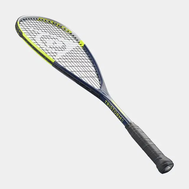 A Dunlop Tristorm Jr 25 squash racket with black strings and grip, in blue and yellow, is placed diagonally on a plain light gray background.