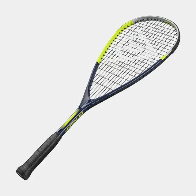 The Dunlop Dunlop Tristorm Jr 25 Squash Racket features a black grip, dark blue frame with yellow accents, a teardrop-shaped head, and tightly strung strings, displayed on a plain white background.