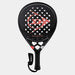 The Dunlop Galactica OS Padel Racket is a black racket with a red logo, honeycomb design, multiple circular holes, Tri-Max reinforcement for stability, and features a black handle with an attached wrist strap.