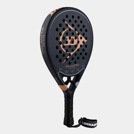 The Dunlop Galactica OS Lite Padel Racket by Dunlop features black 3K Carbon with bronze details, a honeycomb pattern, circular holes, Tri-Max reinforcement for strength and control, and a wrist strap. Displayed on a white background.