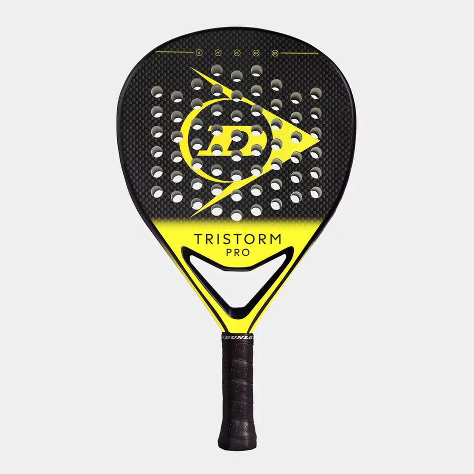 The Dunlop Tristorm Pro Padel Racket by Dunlop features a black and yellow graphite build, perforated head, Dunlop logo and text on the face, and a wrapped handle, shown against a plain white background.