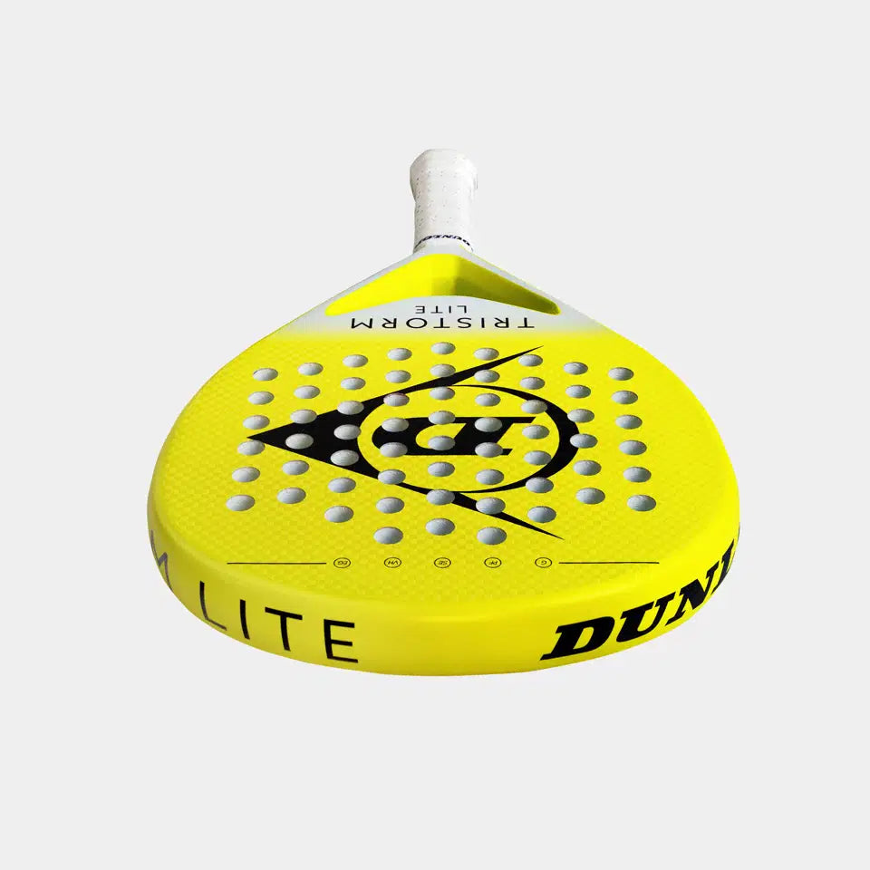 The Dunlop Tristorm Lite Padel Racket by Dunlop is yellow with a white handle, made of graphite, featuring a circular black pattern and multiple holes on the face, shown against a white background.