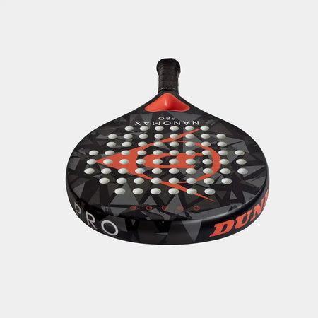 The Dunlop Nanomax Pro Padel Racket by Dunlop features a black and red geometric design, graphite frame bat, hybrid headshape, and evenly spaced holes, with "DUNLOP" on the side, shown against a plain white background.