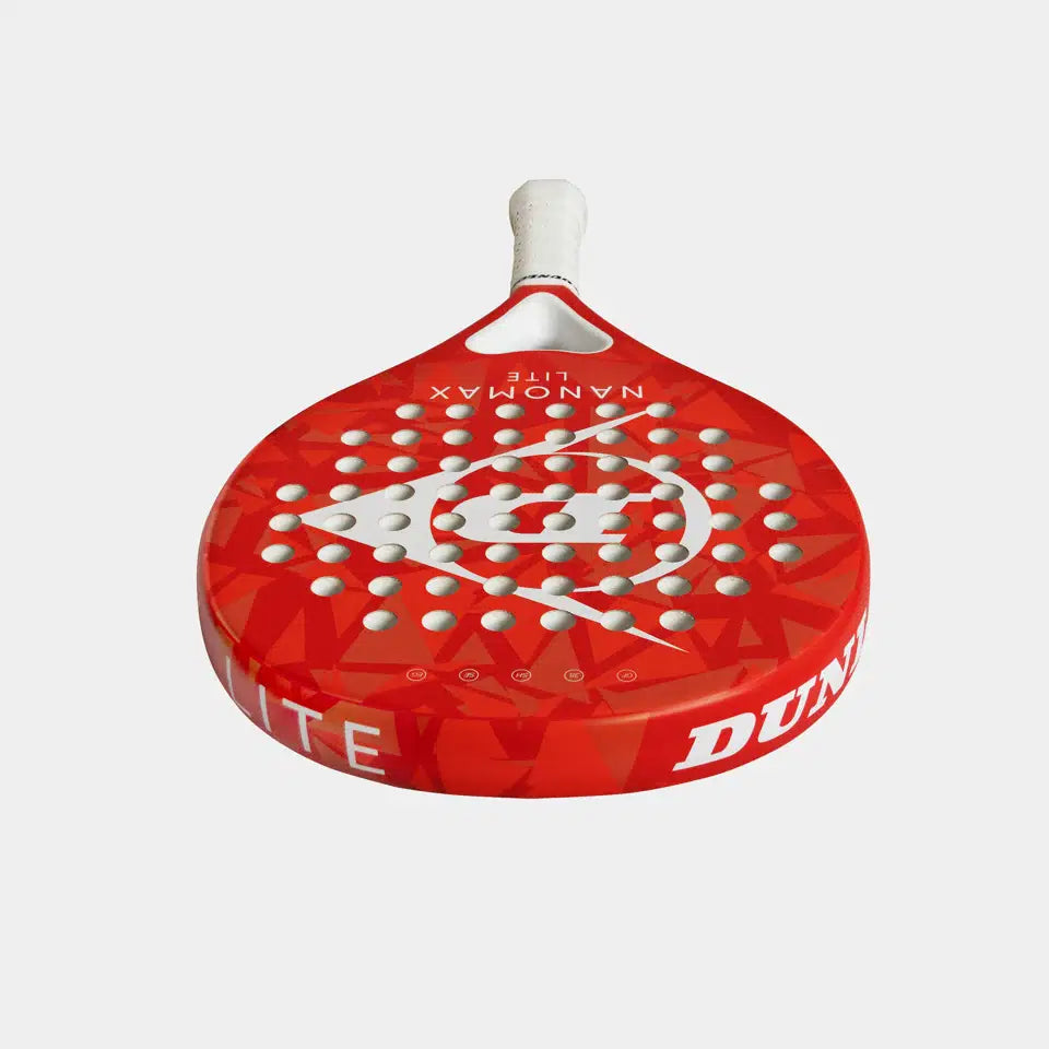 The Dunlop Nanomax Lite Padel Racket features a red design with white holes, a white handle, geometric pattern, and "NANOMAX LITE" text. Its durable graphite frame and hybrid headshape offer enhanced performance.