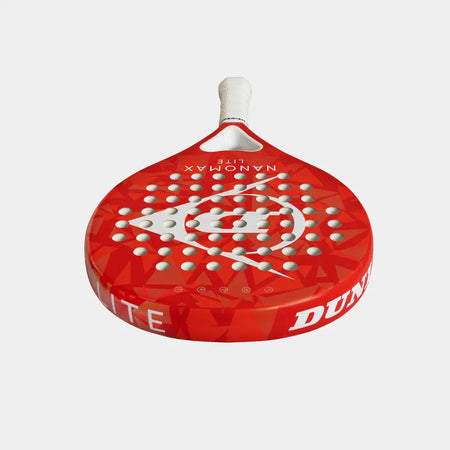 The Dunlop Nanomax Lite Padel Racket features a red design with white holes, a white handle, geometric pattern, and "NANOMAX LITE" text. Its durable graphite frame and hybrid headshape offer enhanced performance.
