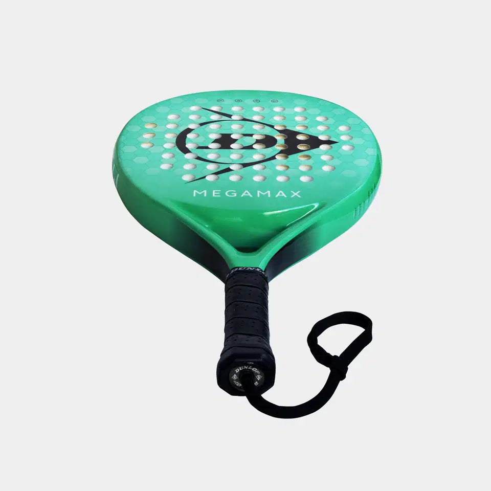The Dunlop Megamax Green Padel Racket by Dunlop, featuring a graphite frame, black handle with wrist strap, circular holes, bold logo, and MEGAMAX text, is photographed on a plain background—ideal for beginners.
