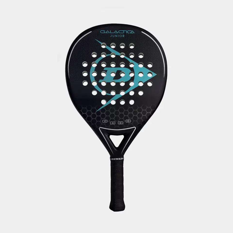 The Dunlop Galactica Junior Padel Racket features a black design with teal accents, a graphite frame, central circular holes, and a hexagonal lower face pattern, shown on a plain light background.