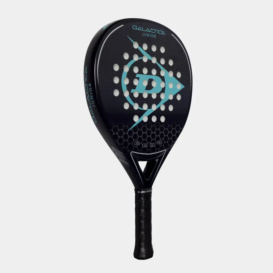 The Dunlop Galatica Junior Padel Racket features a graphite frame, honeycomb pattern, blue arrow graphic, and circular face holes, shown in black against a plain light background.