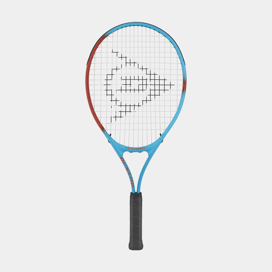 A Dunlop Tristorm Junior Tennis Racket in blue and red with a black handle and logo on the strings is displayed against a white background, making it perfect for kids.