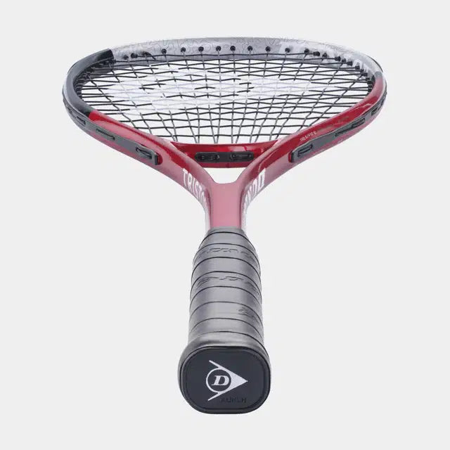 A close-up shows the handle and strings of the Dunlop Tristorm Tour Squash Racket by Dunlop, in red and black, standing upright against a plain white background.