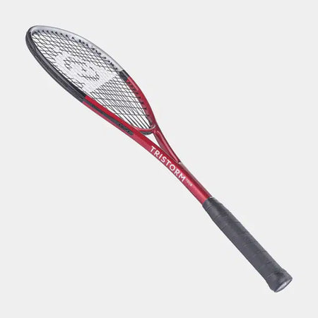 The Dunlop Tristorm Tour Squash Racket features a red and black design with a black grip and white strings, isolated on a light grey background—perfect for beginner players.