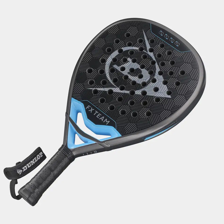 The Dunlop FX Team Padel Racket by Dunlop is black and blue with a perforated face, textured hexagonal surface featuring SpinBoost technology, and comes with a wrist strap attached to the handle.