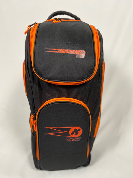 A black and orange Katchet KoachSak One2One bag with multiple zippered compartments, top carrying handle, perfect for one-to-one coaching, stands upright on a white background.