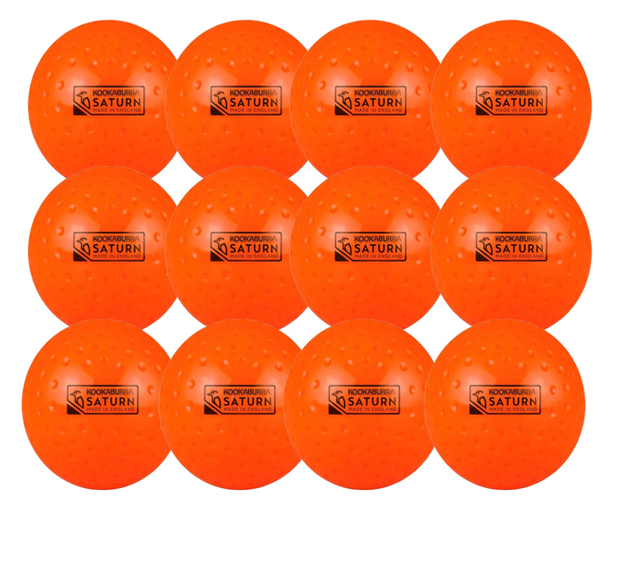 Twelve orange Kookaburra Dimple Saturn Hockey Balls (12 Pack) by Kookaburra are arranged in three rows, each with a dimpled surface and a rectangular "Kookaburra Saturn" label on the front.