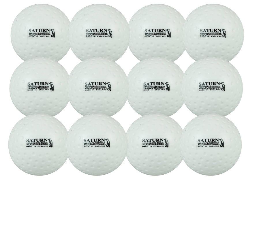 Twelve white Kookaburra Dimple Saturn Hockey Balls are arranged in a grid. Each has "SATURN" and "CRICKET TOURNAMENT" printed in black, making them an ideal unique training ball for multiple sports.