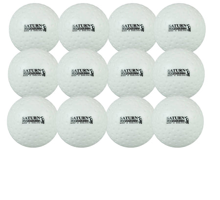 Twelve white Kookaburra Dimple Saturn Hockey Balls are arranged in a grid. Each has "SATURN" and "CRICKET TOURNAMENT" printed in black, making them an ideal unique training ball for multiple sports.