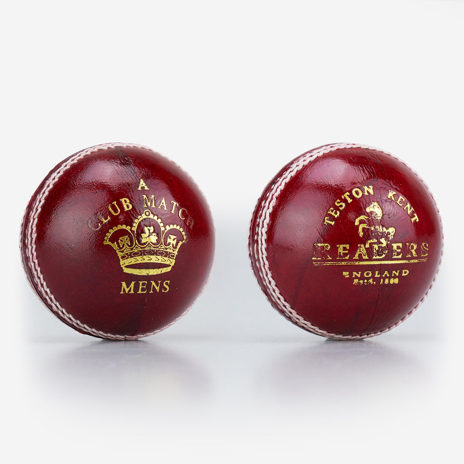 Two red Readers Club Match cricket balls made from imported leather with white stitching; one reads "A Club Match Mens" and features a gold crown, the other says "Teston Kent Readers England Est. 1808" in gold text with a crown.
