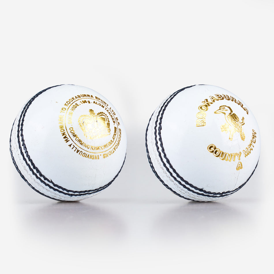Two white Kookaburra County Match Cricket Balls from Kookaburra are placed side by side on a plain white background.