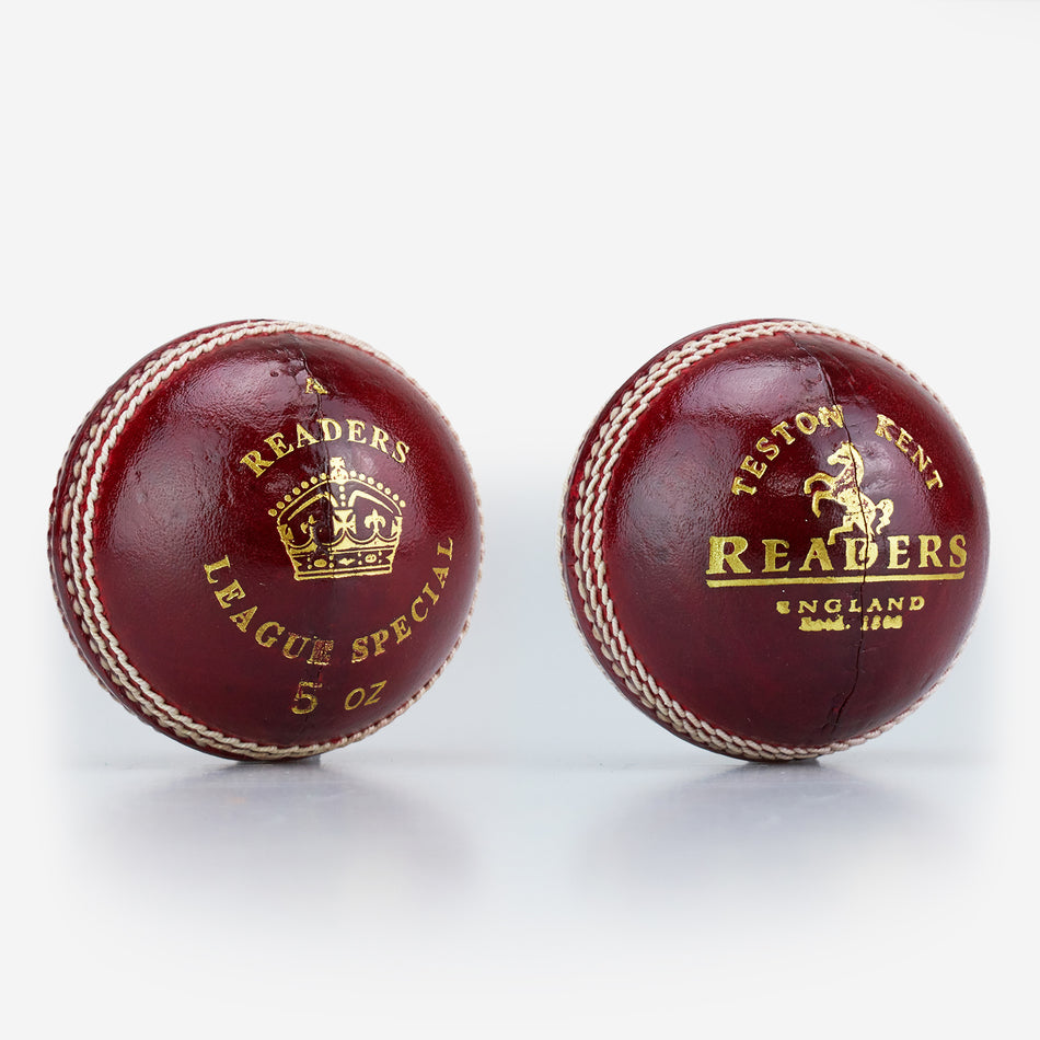 Two red leather, hand-stitched Readers women's cricket balls with gold detailing: one features "Readers League Special 5 oz" with a crown, the other has "Teston Kent Readers England" with a horse and company details. Suitable for women's cricket.