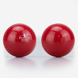 Two shiny red Readers Indoor 4oz Cricket Balls lie side by side on a white surface—one features the Readers logo, while the other highlights its smooth, lightweight plastic design, perfect for indoor training or coaching.