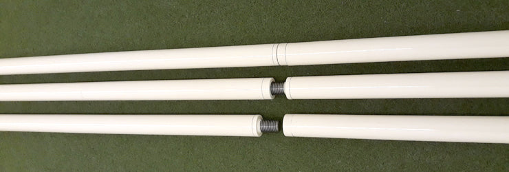 Two-Part Legs for Bola Professional Bowling Machine by Bola shown: three white rods on a green surface—top rod intact, two below separated at the center to display screw joints unique to the two-part design.