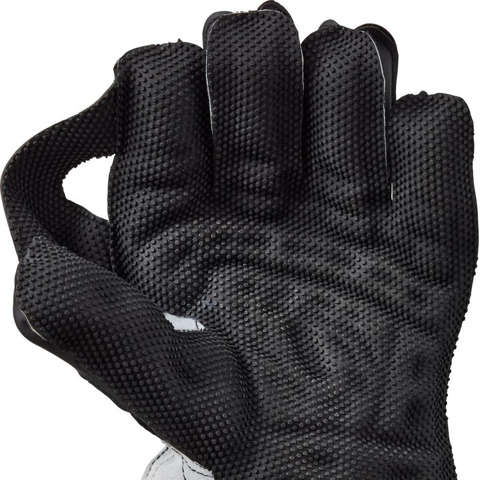 A hand wears Gunn & Moore Rival 909 Wicket Keeping Gloves 2026 with a padded cuff, fingers curled and thumb touching the index finger, forming an OK gesture to show the superior grip of these Gunn & Moore gloves.